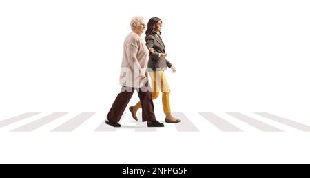 Junge und ältere Frau, die auf einem Pädestirankreuz auf weißem Hintergrund läuft Stockfoto