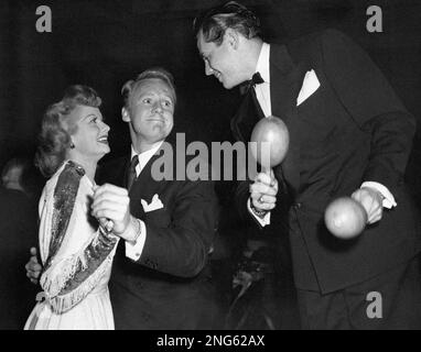 Lucille Ball, who recently divorced Desi Arnaz, attends the annual SHARE  charity party withn composer Jimmy Van Heusen in Hollwood, Calif. on May  13, 1960. The organization is composed of wives of