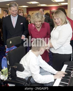 The Prince of Wales and Duchess of Cornwall meet staff and patients during a visit to open the Shooting Star House Children's Hospice in Hampton, south-west London, Tuesday 21st February, 2006. (AP Photo/Michael Dunlea/Dail Mail, Pool)
