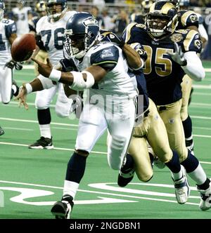 St. Louis Rams' Aeneas Williams, holds his son, Lazarus, as he celebrates  the Rams' 29-24 victory over the Philadelphia Eagles in the NFC  Championship game Sunday, Jan. 27, 2002 in St. Louis. (