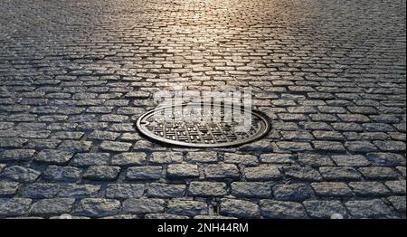 Sonnenlicht scheint auf einem Gullydeckel in einer alten kopfsteingepflasterten Straße in New York City NYC Stockfoto