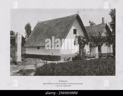 Architektur des alten Spaniens. Vintage-Foto von Bauernhäusern im valencianischen Stil mit Dächern mit Reistroh. Valencia. Spanien. Stockfoto