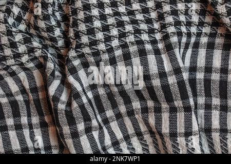 Hintergrund Textur, Muster. Schal wolle wie Yassir Arafat. Die Palästinensische Kufiya ist ein Geschlechtsneutraler kariert Schwarz und Weiß Schal, üblich ist Stockfoto