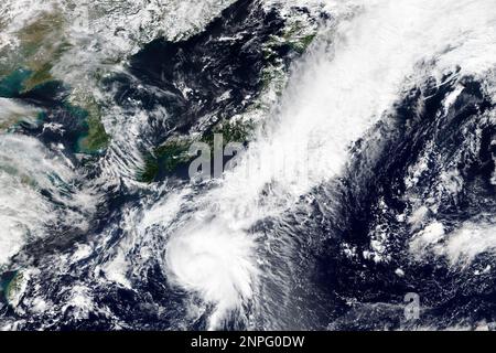 This Monday, Sept. 21, 2020, satellite image released by NASA Worldview, Earth Observing System Data and Information System (EOSDIS) shows Tropical Storm Dolphin moving northbound toward Japan. The tropical storm developing in the Pacific Ocean, was slowly sweeping toward Japan Tuesday, threatening the main island of Honshu with heavy rainfall and harsh winds. (NASA via AP)