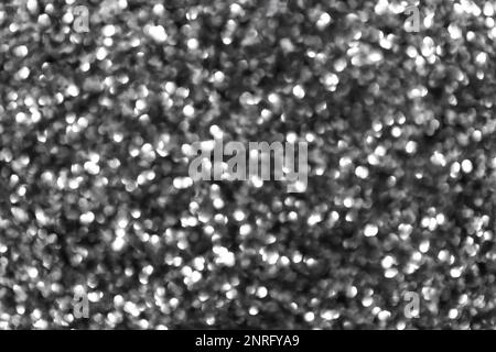 Abstraktes schwarzes Hintergrund-Bokeh von Lichtern. Unschärfe-Effekte und Staubpartikel Stockfoto