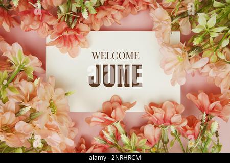 Willkommenstext im Juni mit Blumenrahmen auf pinkfarbenem Hintergrund Stockfoto
