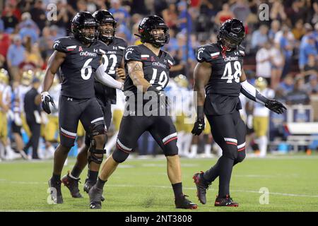 August 29, 2019: Cincinnati's Ethan Tucky (19) struts to celebrate his sack with teammates Perry Young (6) and Kevin Mouhon (48) during an NCAA football game between the Cincinnati Bearcats and the UCLA Bruins at Nippert Stadium in Cincinnati, Ohio. Kevin Schultz/CSM(Credit Image: © Kevin Schultz/CSM via ZUMA Wire) (Cal Sport Media via AP Images)