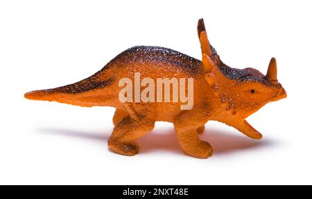 Orange Dinosaurier Toy Side View, ausgeschnitten auf Weiß. Stockfoto
