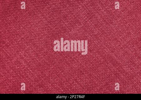 Gewebte Polsterung im Jacquard-Design, hellrote, grobe Stoffstruktur mit diagonalen Weblinien. Textilhintergrund, Möbeltextilien, Tapete, Rückseite Stockfoto
