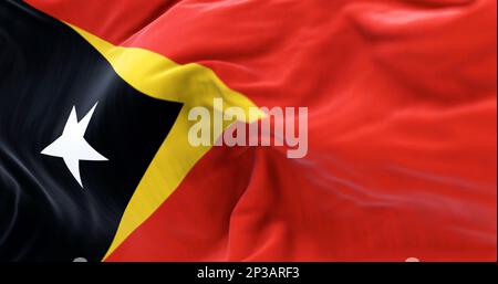 Detail der Osttimor-Nationalflagge. Roter Hintergrund mit einem gelben Dreieck und ein schwarzes Dreieck mit einem weißen Stern. Rendern der 3D-Darstellung. Auswählen Stockfoto