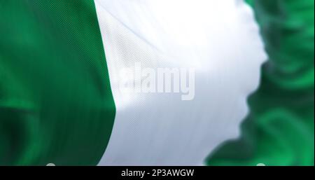 Nahaufnahme der nigerianischen Nationalflagge. Drei gleiche vertikale Bänder: Grün, weiß und grün. Rendern der 3D-Darstellung. Selektiver Fokus. Schließen- Stockfoto