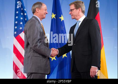 New US ambassador to Germany John B. Emerson, left, shakes hands with German Foreign Minister Guido Westerwelle in Berlin, Germany, Wednesday, Aug. 28, 2013. (AP Photo/dpa, Maurizio Gambarini)