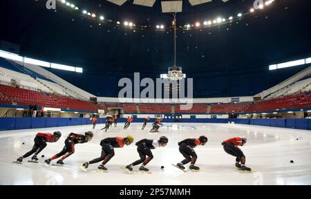 Skaters round the track during a practice session in preparation for the short track speed skating Olympic trials Wednesday, July 31, 2013 in Montreal. (AP Photo/The Canadian Press, Paul Chiasson)
