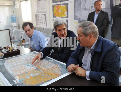 U.S. Secretary State John Kerry, center, Jordanian Foreign Minister Nasser Judeh, right, and US Ambassador to Jordan Stuart Jones, left, sit in front of a map during a briefing at Zaatari refugee camp on Thursday, July 18, 2013 near the Jordanian city of Mafraq, some 8 kilometers from the Jordanian-Syrian border. Visiting the Zaatari refugee camp in northern Jordan, Kerry met six representatives of its 115,000-strong population, all of whom appealed to him to create no-fly zones and set up humanitarian safe havens inside Syria. The Obama administration has boosted assistance to the Syrian oppo