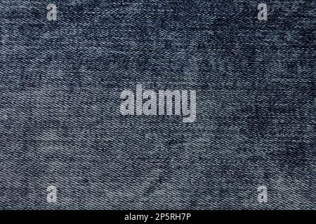 Hintergrundstruktur aus blauem Jeans-Material. Blue Jeans Stoff Stoff Textil Material. Stockfoto