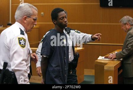 Nicholas Lindsey, 16, center, accused of killing St. Petersburg Police