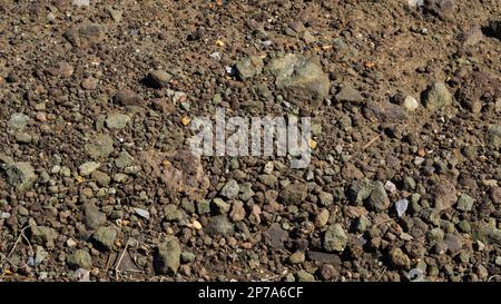 Dunkler, Strukturierter Kies-Hintergrund Stockfoto