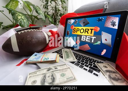 Laptop-Sportwetten und kanadische Flagge Stockfoto