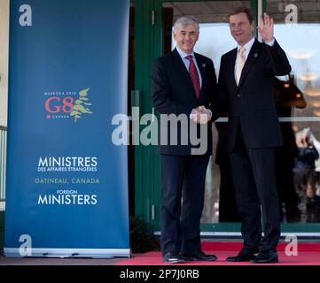 Minister of Foreign Affairs Lawrence Cannon shakes hands with German Foreign Minister Guido Westerwelle as he arrives at the G8 Foreign Ministers meeting in Gatineau, Tuesday March 30, 2010. (AP Photo/The Canadian Press, Sean Kilpatrick)