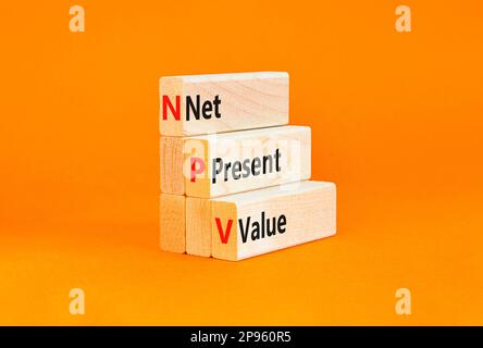 NPV net present value symbol. Concept words NPV net present value on wooden blocks on a beautiful orange table orange background. Business and NPV net Stockfoto