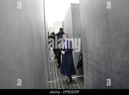 Maryam Rajavi, centre, leader of the National Council of Resistance, the political wing of PMOI, People's Mujahedeen Organization of Iran, walks through the Holocaust memorial in Berlin, Germany, Tuesday, Nov. 25, 2008. An Iranian activist urged German lawmakers on Monday to help remove an Iranian opposition group from the EU's list of terrorist organizations. 'This terror listing is unjust, unlawful,' Maryam Rajavi told reporters as she argued on behalf of the blacklisted People's Mujahedeen of Iran, or PMOI. (AP Photo/Herbert Knosowski)