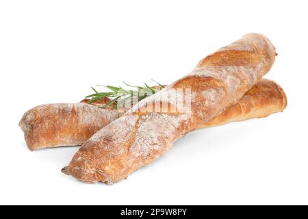 Knusprige französische Baguettes mit Rosmarin auf weißem Hintergrund. Frisches Brot Stockfoto