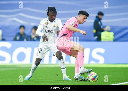 Madrid, Spanien. 11. März 2023. Real Madrids Eduardo Camavinga (L) spielt mit Espanyols Ruben Sanchez während eines Spiels von La Liga Santander zwischen Real Madrid und RCD Espanyol im Santiago Bernabeu Stadion, Madrid, Spanien, am 11. März 2023. Kredit: Gustavo Valiente/Xinhua/Alamy Live News Stockfoto