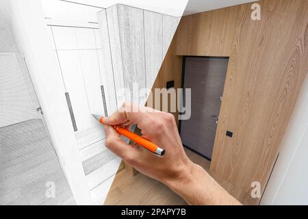 Menschliche Hand mit Bleistift, die ein modernes Badezimmer mit stilvoller Inneneinrichtung gestaltet Stockfoto