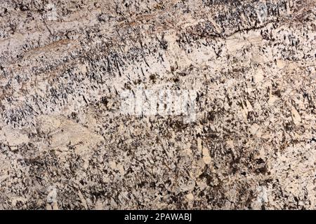 Striktes Alaska-Weiß - Hintergrund aus Granit, moderne Textur in wunderschönen Farben, Teil des Designprojekts. Exklusives, hochwertiges mattes Material. Poliertes Deluxe Stockfoto