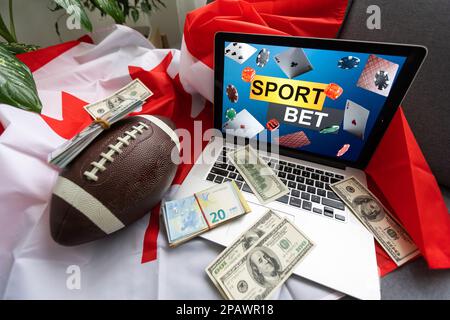 Laptop mit Sportwetten und kanadischer Flagge Stockfoto