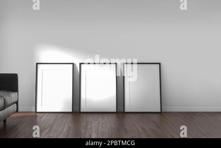 Zwei Rahmen neben einem Sofa an einer weißen Wand im Hintergrund und Sonnenlicht durch das Fenster. 3D-Rendern. Stockfoto