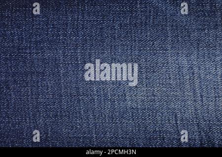 Hintergrundstruktur aus blauem Jeans-Material. Blue Jeans Stoff Stoff Textil Material. Stockfoto