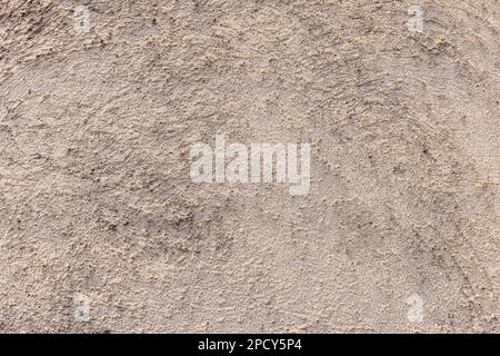 Grunge-Wand mit rauer Struktur in Beige. Abstrakter Hintergrund Stockfoto