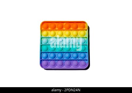 Sensorisches Anti-Stress-Spielzeug Pop it Fidget Toy farbenfroh auf weißem Hintergrund. Speicherplatz kopieren Stockfoto