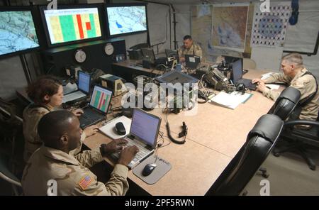 U.S. Army officers work inside the TOC (Tactical Operations Center) of ...