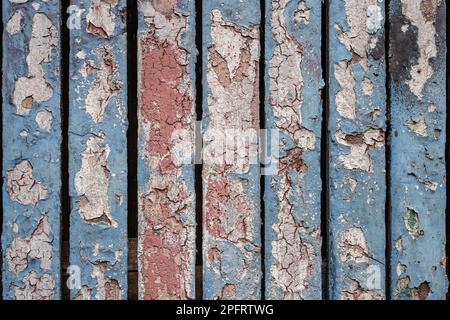 Grungy abstrakter Hintergrund von Schichten von Peeling-Farbe an einer Tür oder Wand Stockfoto