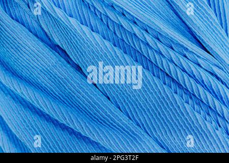 Eine Nahaufnahme eines weichen blauen Stoffhintergrunds Stockfoto