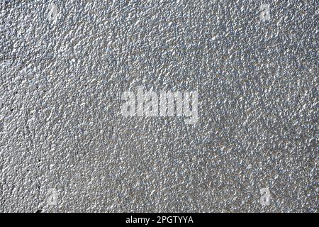 Hintergrund einer silberfarbenen und verputzten Wand Stockfoto