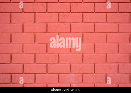 Hintergrund einer roten Steinmauer Stockfoto