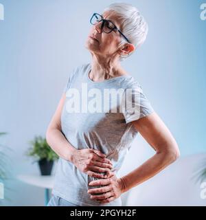 Frau vor Schmerzen Stockfoto