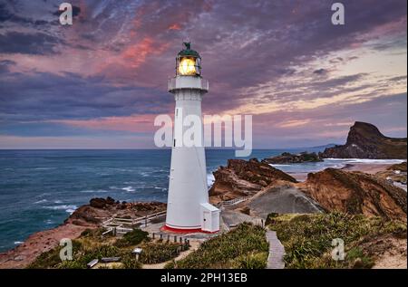 Castle Point Lighthouse, Sonnenaufgang, Wairarapa, Neuseeland Stockfoto