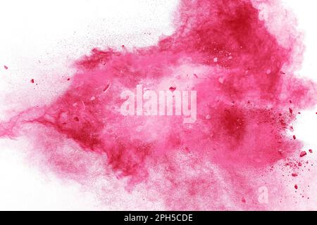 Steintrümmer, die mit rosa Pulver auf weißem Hintergrund explodieren. Stockfoto