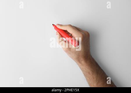 Mann mit roter Markierung auf weißem Hintergrund, Draufsicht Stockfoto