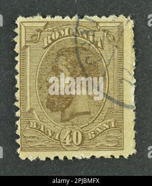 Von Rumänien gedruckter Stempel mit annullierter Briefmarke, auf dem König Carol I von Rumänien (1839-1914), ca. 1900, zu sehen ist. Stockfoto