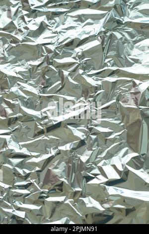 Struktur aus Metallfolie. Metallischer Hintergrund. Metall glitzert, zerdrückt, glister Oberfläche, Hintergrund. Zerknitterte Textur. Reflektierende Oberfläche. Gefaltet, rumpel Stock Vektor