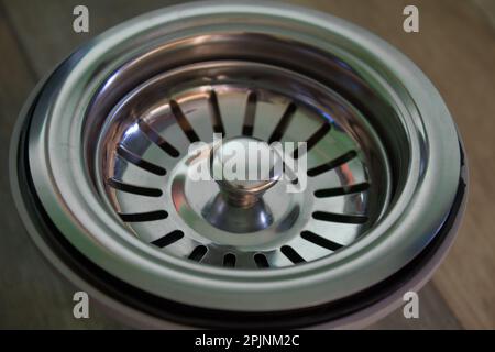 Metallloch für raquin vom Siphon Stockfoto