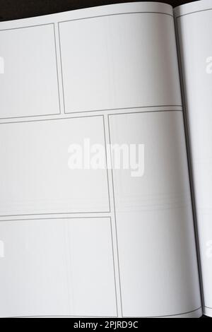 Öffnen Sie ein Buch mit Layout- oder Rahmenfeldern auf leeren weißen Seiten Stockfoto