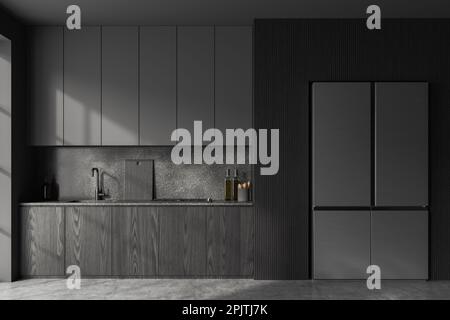 Inneneinrichtung einer stilvollen Küche mit grauen Wänden, Betonboden, dunklen Holzschränken mit eingebautem Herd und Waschbecken und großem Kühlschrank. 3D-Rendering Stockfoto