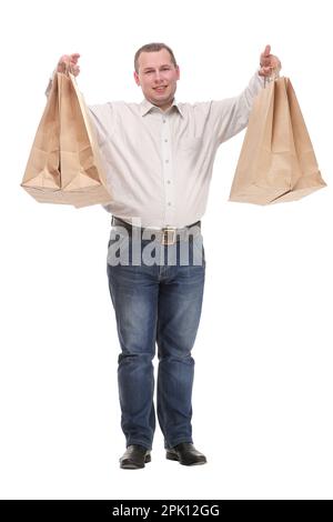 Gut aussehender junger Mann mit Einkaufstaschen Stockfoto