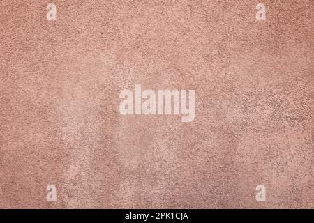 Die Textur der pinkfarbenen Gipswand als Hintergrund Stockfoto